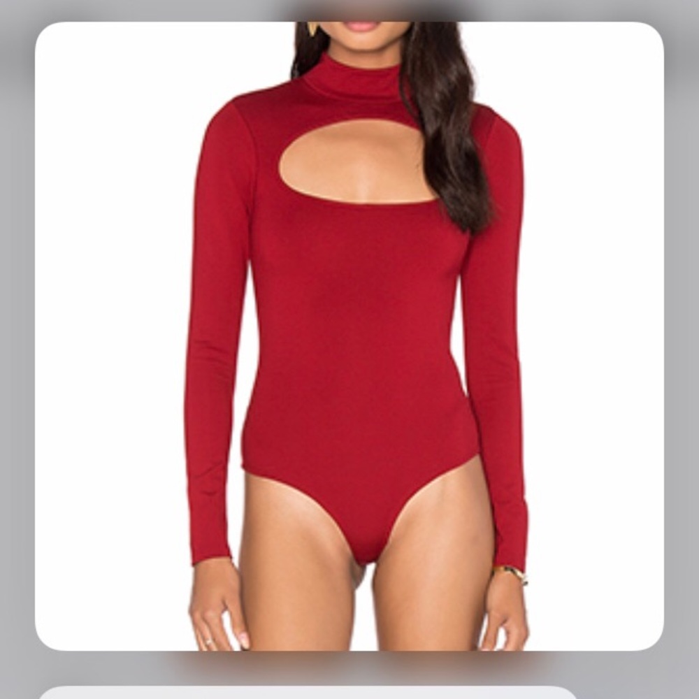 Bebe. NWOT. Red Key Hole Front & Back Body Suit Open Sleeve Never Worn Medium